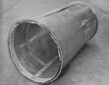 FIG. 18. Model pressure cabin (ends removed) after water test.