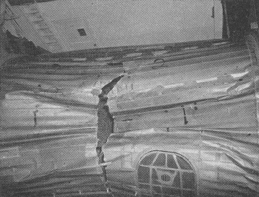 FIG. E. Test failure of a fuselage section due to external pressure.